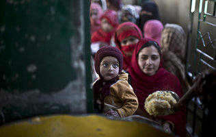 Muslim women awaiting donated food